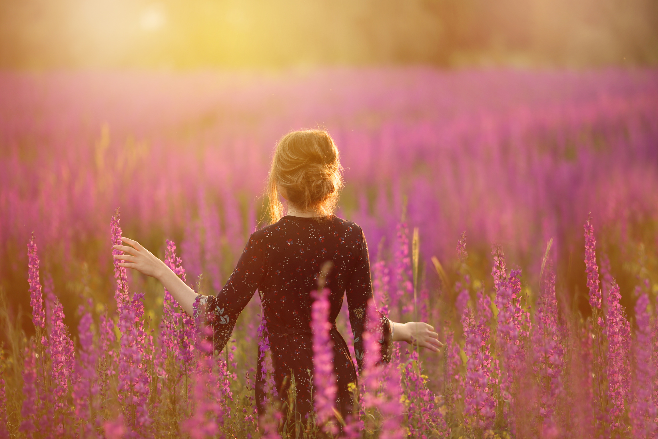Woman standing on a Flower Field 